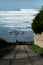 Rocky beach for surfers under a cliff