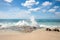 Rocky beach view at Caribbean sea coast, with light blue sky, turquoise water and white clouds. Sunny beach landscape with rocks