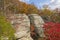 A Rocky Bluff Nestled in the Fall Forest