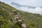 Rocky boulders on the mountainside against the mountains in the clouds on the Crimean Peninsula