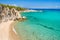 Rocky cliff above the beautiful clear water