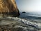 Rocky cliff landscape. Sea surf on a rocky beach. Petra tou Romiou, Aphrodite's beach. Large stone in the sea.