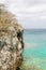 Rocky Cliff Overlooking Aqua Sea