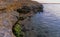 Rocky cliff shore, destroyed by sea waves in the Crimea