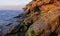 Rocky cliff shore, destroyed by sea waves in the Crimea