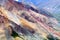 Rocky cliffs above the Kaskawulsh River in Kluane National Park, Yukon, Canada