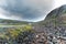 Rocky cliffs on the coast of the Barents Sea along the Varanger Tourist Route, Finnmark, Norway