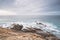 Rocky cliffs with futuristic patterns on the Atlantic coast near the town of Aljezur in southwestern Portugal. The sound of the