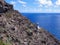 Rocky cliffs and the Makapu`u Point Light, a lighthouse on the eastern tip of Oahu, Hawaii.