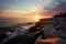 Rocky coast glow Sunset hues grace the tropical beach rocks