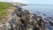 The rocky coast of the island of Ireland. A rocky reef in the Celtic Sea. Beautiful coastline of northern Europe. Nature of