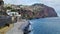 The rocky coast of Madeira Island and the Atlantic Ocean.