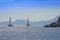 Rocky coast and sailing catamarans, Aegean sea