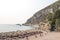 Rocky coastline, bay, beach. People are sunbathing. Europe.