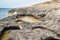 Rocky coastline in Comino Island in Malta.