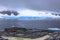 Rocky coastline fjord panorama with mountains, clouds and blue g