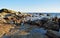 Rocky coastline at low tide below Heisler Park in Laguna Beach, California.