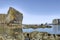 Rocky Coastline with Majestic Cliff Overlooking Calm Clear Waters