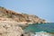 Rocky coastline with Saint Mary`s Battery in Comino Island in Malta.