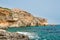 Rocky coastline with Saint Saint Mary\'s Battery in Comino Island in Malta.