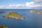 Rocky coastline and the small green rocky islands of Lovund archipelago in the Norwegian sea