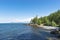 Rocky eastern coast of Lake Baikal in summer. Turquoise colored water under a blue sky. Republic of Buryatia, Russia