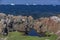 Rocky Fogo Island coastline with icebergs