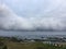 Rocky foreshore and low cloud over the sea