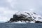 Rocky frozen landscape of Cuverville Island on a stormy day, Southern Ocean, Antarctica