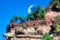 Rocky Geologic Layered Cliff with Trees and Moon