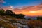 Rocky granite on top of the mountain at sunset