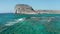 Rocky, green cliff edge, where the land meets the turquoise sea of Greece,Crete