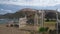 A rocky hill, beach and old white metal gate, Sicily Italy