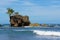 Rocky islet with coconut trees