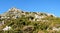 Rocky landscape topped by ruins of fortified castle