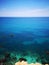 Rocky mediterranean seashore with azure and turquoise color water at Malta