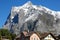 Rocky mountain dominates above the houses