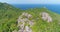 Rocky Mountain Peak Island Landscape Aerial View. Lush Forest Trees Slant Open Ocean Water Surface