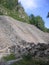 rocky mountain  of rocks slides into the gorge the mudslide filled up the passage after the earthquake in the