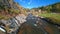 Rocky Mountain Rush: FPV Drone Dive above the river.