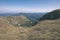 rocky mountain tops with hiking trails in autumn in Slovakian Tatra western Carpathian with blue sky and late grass on hills.