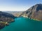 Rocky mountains above Oymapinar Lake, Turkey in the morning. Deep blue water lake. Blurred hills in the distance. Scenic