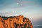 Rocky Mountains cliff and moon sunset Landscape