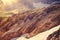 Rocky Mountains with glacier snow and hikers silhouette beyond