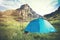 Rocky Mountains Landscape and tent camping with trekking poles and boots Travel Lifestyle