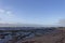 The rocky North Beach at Carnoustie with the tide out and waves crashing on to the beach