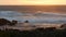 Rocky ocean coast, dramatic sea waves, Monterey beach, California, birds flying.