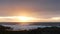 Rocky ocean coast, sea waves, Monterey beach, California, dramatic sunset sky.