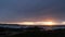 Rocky ocean coast, sea waves, Monterey beach, California, dramatic sunset sky.