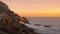 Rocky ocean shore with seals, sunset, ocean scene